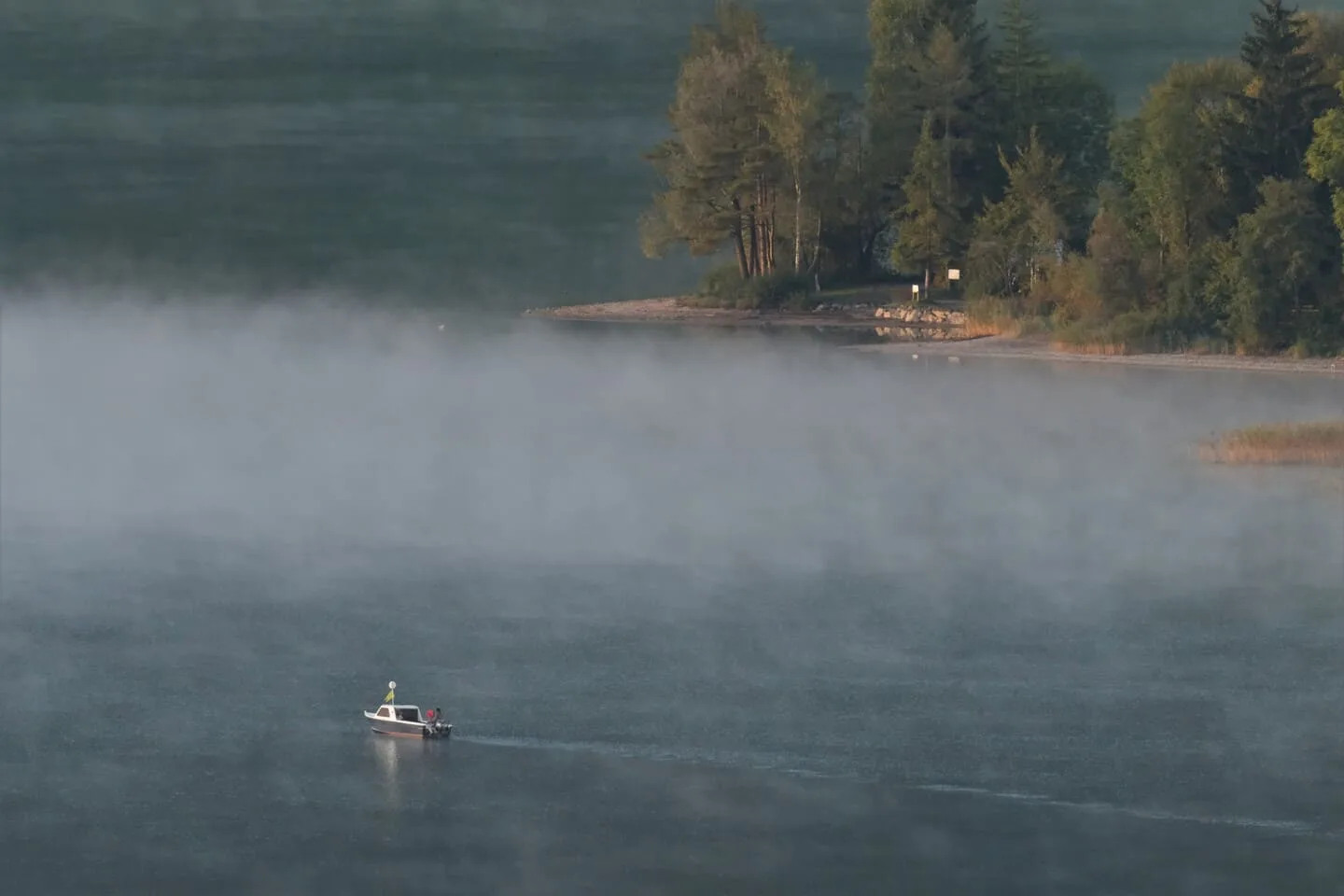 Sailing in the fog of the Ägerisee (Lake Aegeri) in Autum.