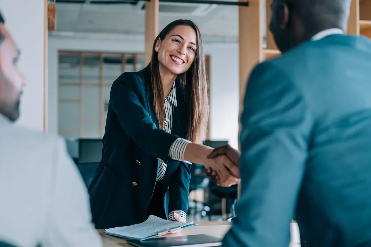 Woman holding hands in an office environment